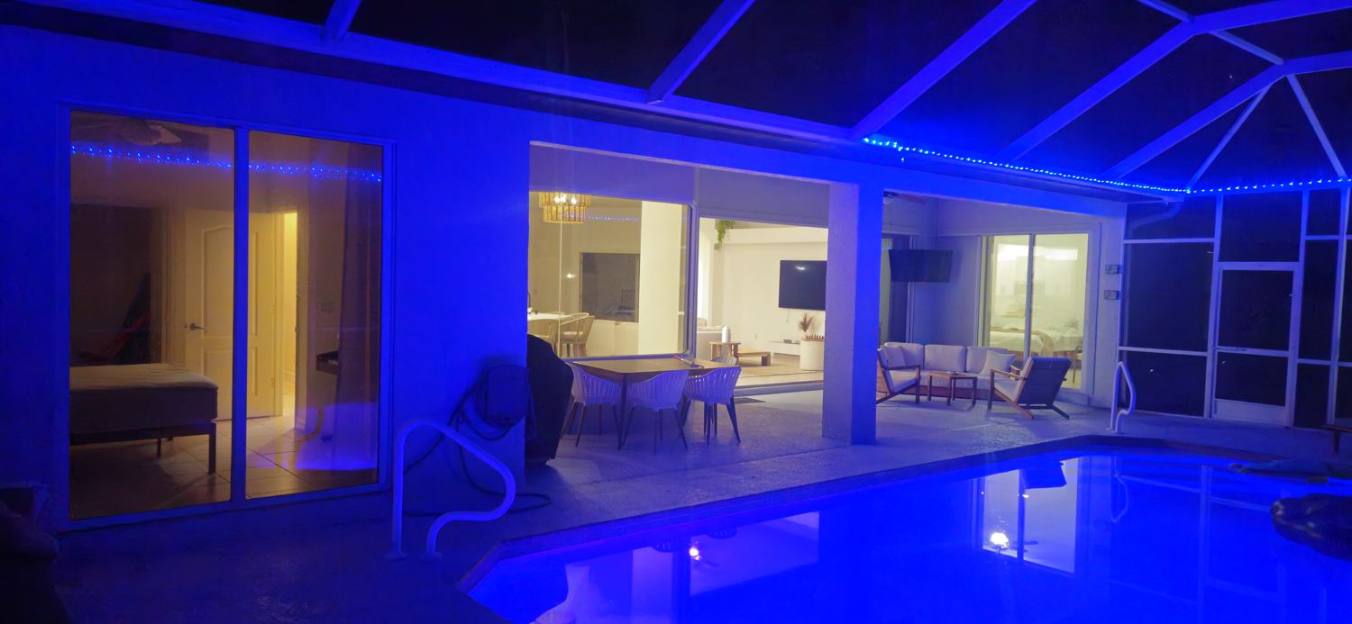 Private swimming pool illuminated at night